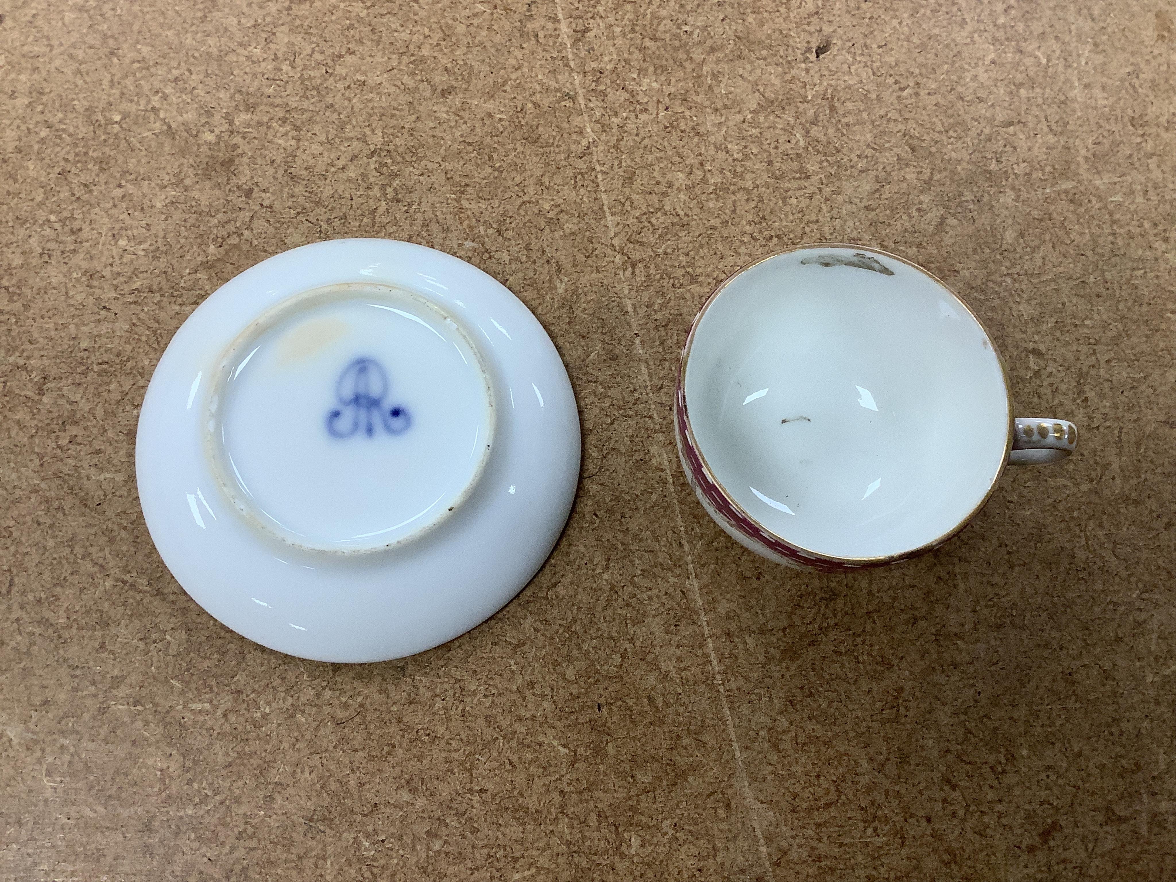 A group of 19th/20th century German porcelain, comprising a Nymphenburg pug, seven Dresden miniature cups and saucers and a Meissen bottle, largest 13cm high